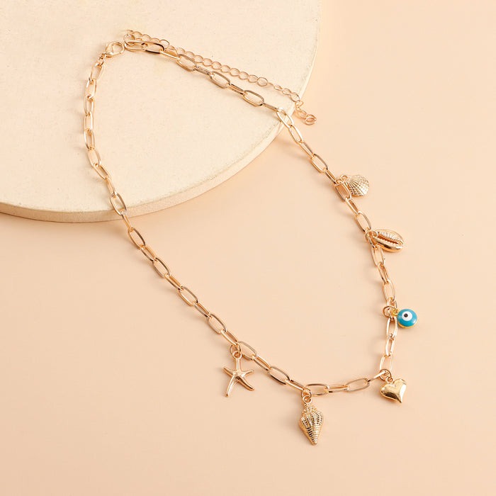Salty Opulent Gold Tassel Charm Necklace